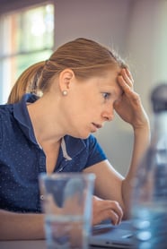 Frustrated person at computer