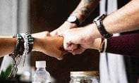 Hands of engaged workers